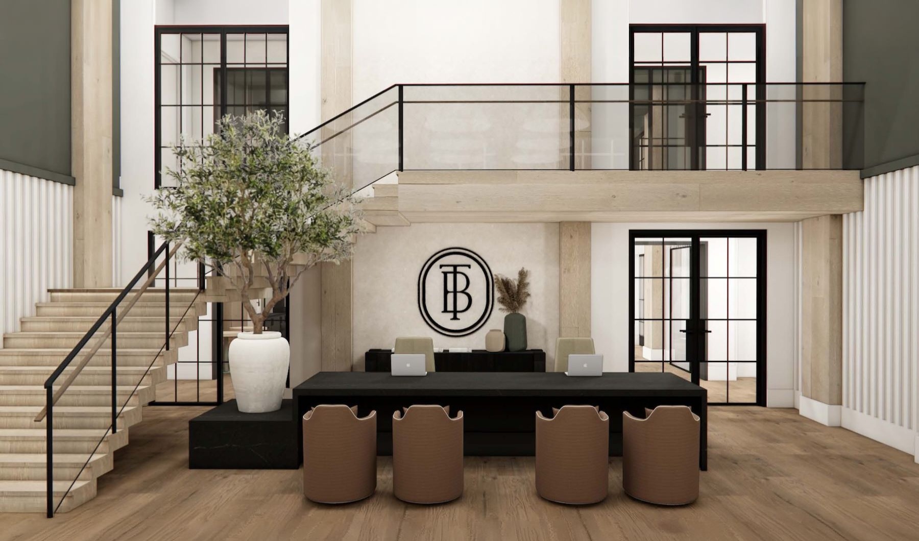 a leasing office with a desk, chairs and stairs